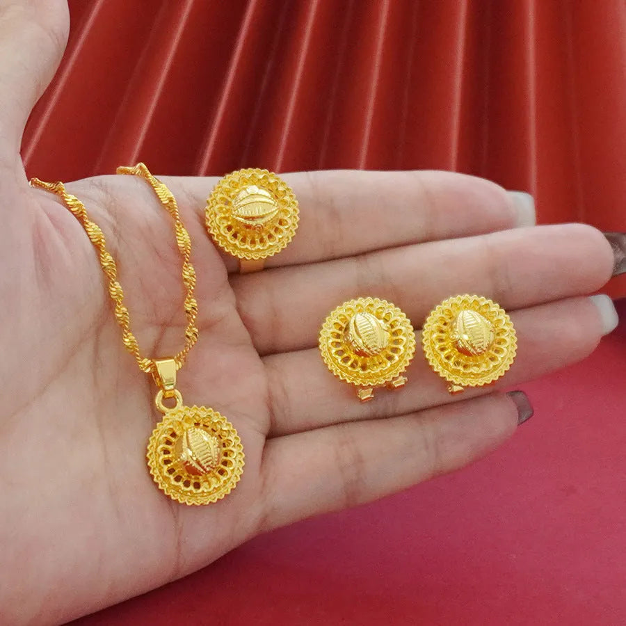 Three-piece gold-plated floral jewellery suit with necklace, earrings and ring on water wave chain