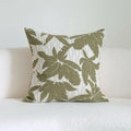 Green cotton and linen hotel sample pillow with tassel details and botanical patterns for display use