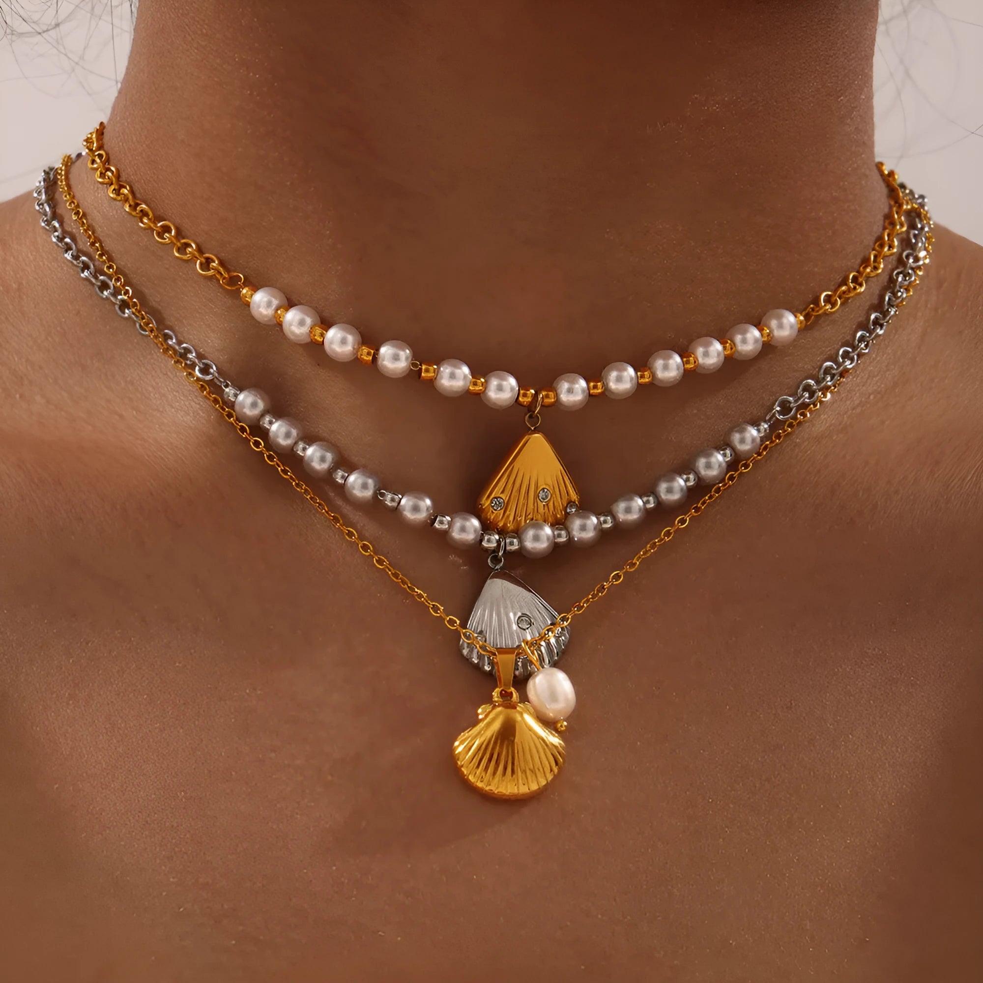 Women's titanium steel necklace with freshwater pearl bead pendant on O-shaped chain.
