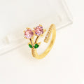Women's geometric open ring with gold-plated copper construction, leaf design, and zircon crystal accents