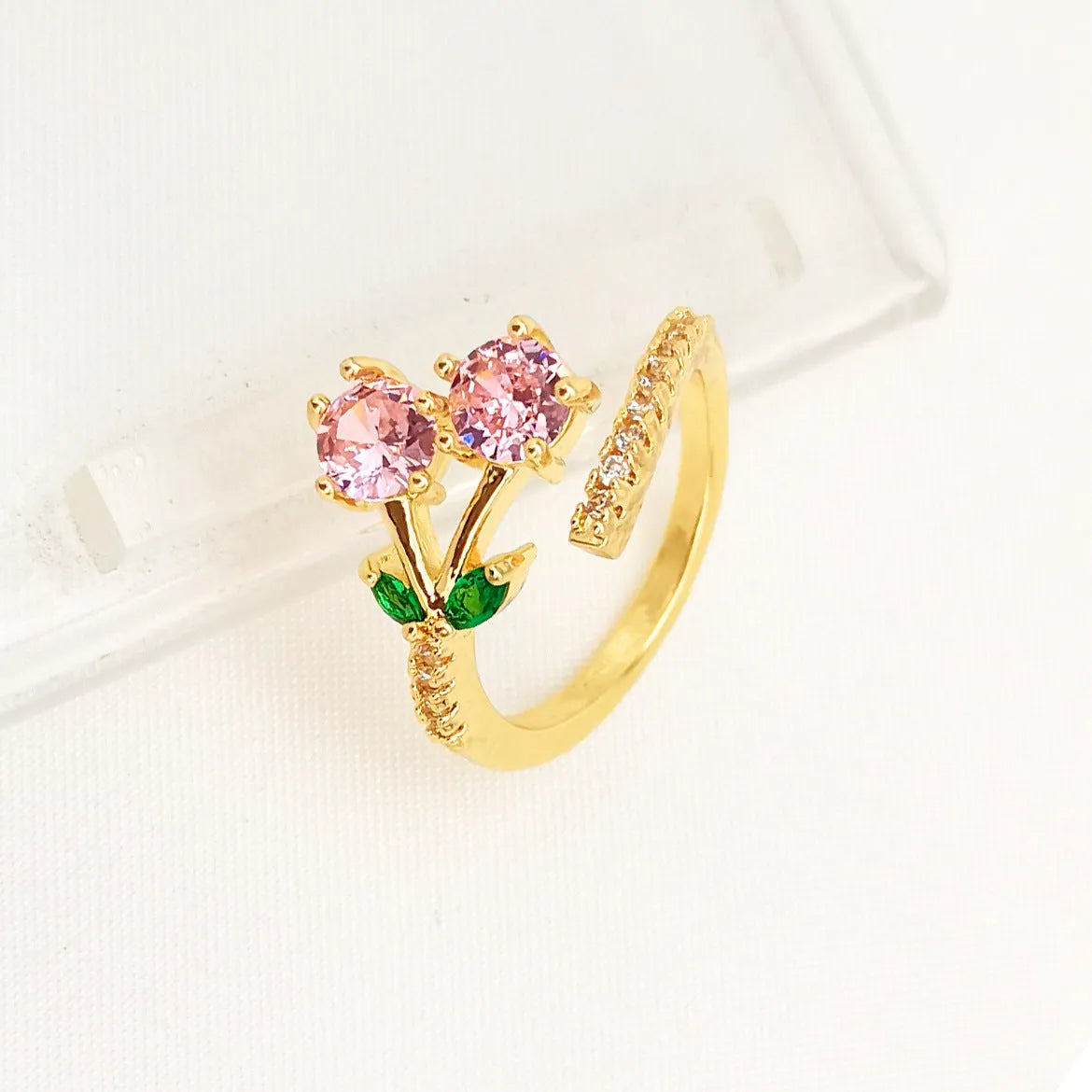 Women's geometric open ring with gold-plated copper construction, leaf design, and zircon crystal accents