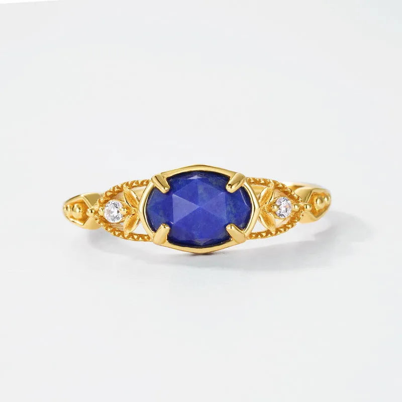 Geometric lapis lazuli silver ring with elliptical shape and round elements