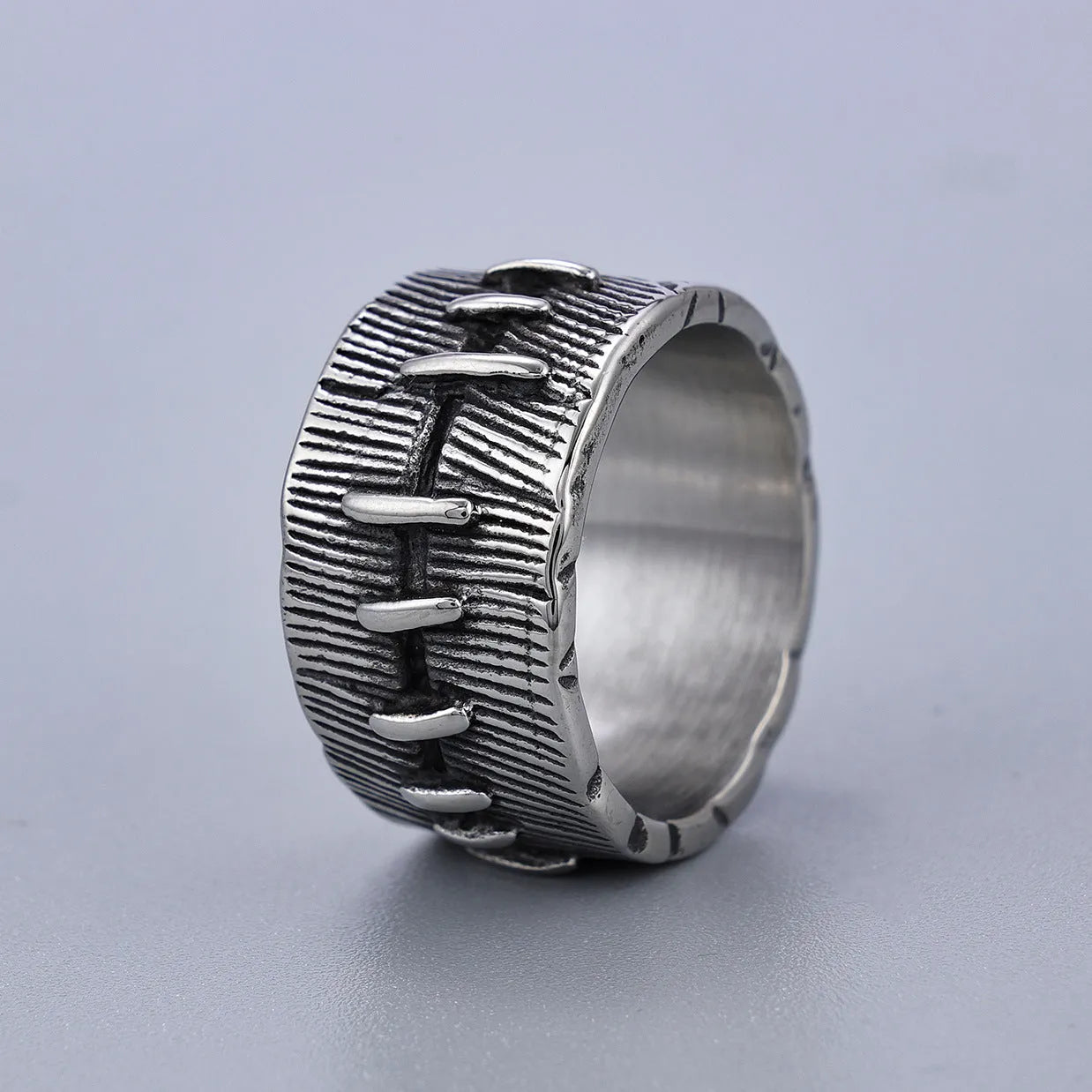 A geometric U-shaped titanium steel punk ring with a double ring design in a retro dark colour.