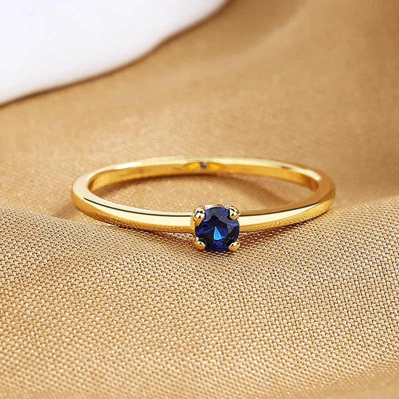 Women's fine copper circle ring with geometric design and single diamond in multiple colour options