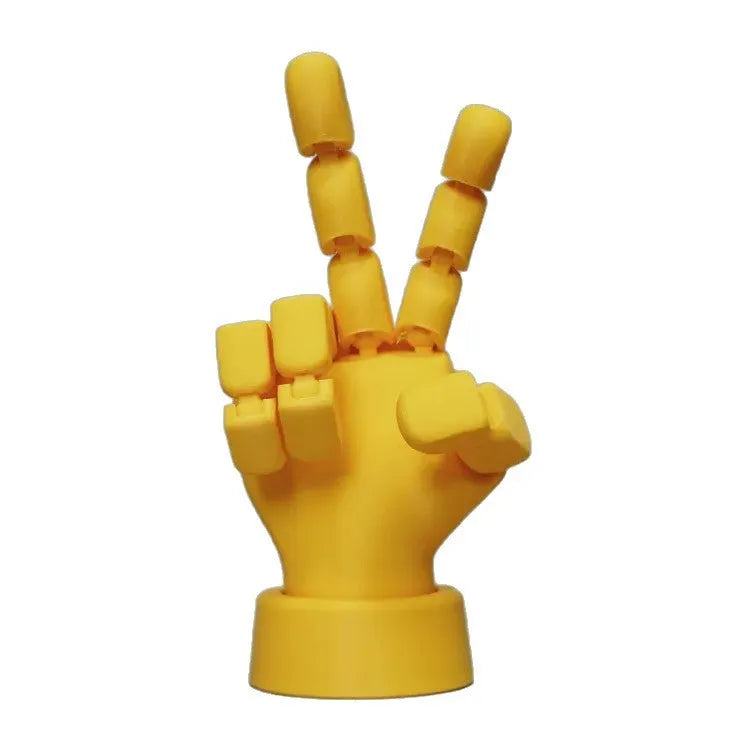 Yellow movable joint hand prop ornament made of PLA plastic on white background