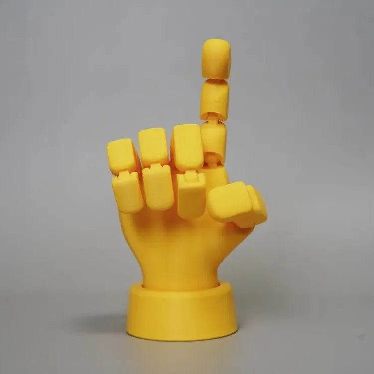 Yellow movable joint hand prop ornament made of PLA plastic on white background