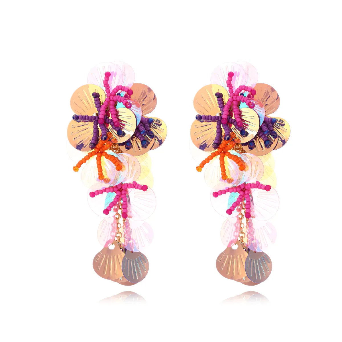 Close-up of handmade colourful bead flower and leaf statement earrings on a white background.