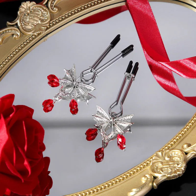 Silver alloy adjustable bat nipple clamp with ruby decorative clip for adult use.
