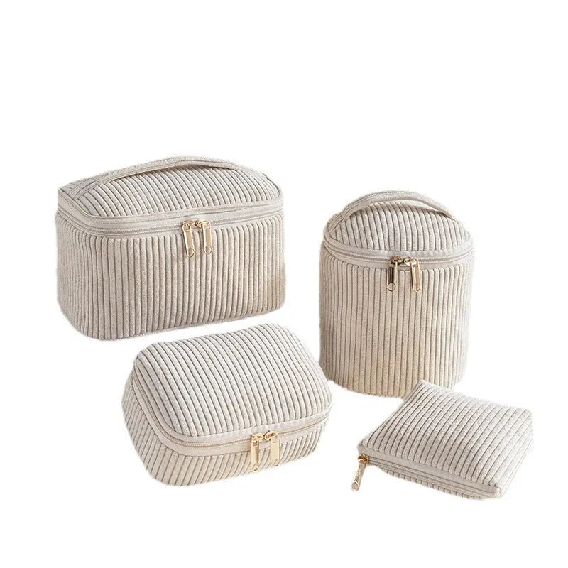 Four cube-style flannelette makeup bags in a set, shown in blue with dots colour option.