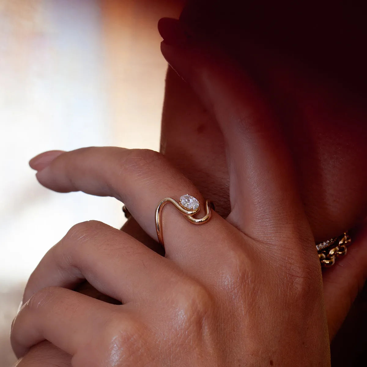Geometry design titanium steel zircon ring on a hand, showing stainless steel band and contemporary styling.