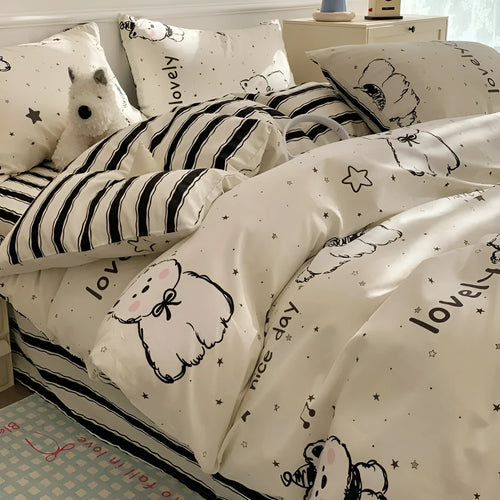 Cartoon dog pattern cotton bed sheet four-piece set shown on bed with matching pillowcases