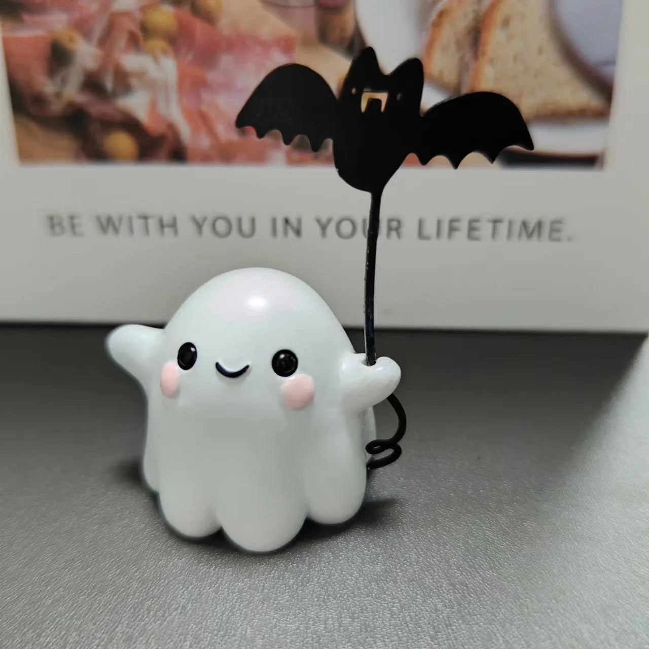 Mini ghost walking dog Halloween statue in resin, ghost holding bat design.