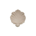 Close-up of a white resin decorative ornament with a detailed seashell design for fruit plates and table displays.