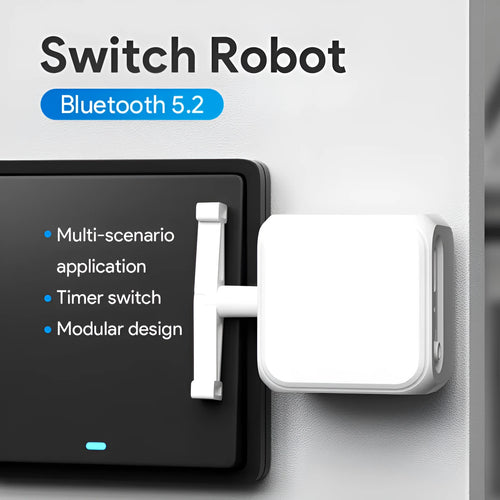 Small white Bluetooth rocker arm finger robot with remote control on a table.