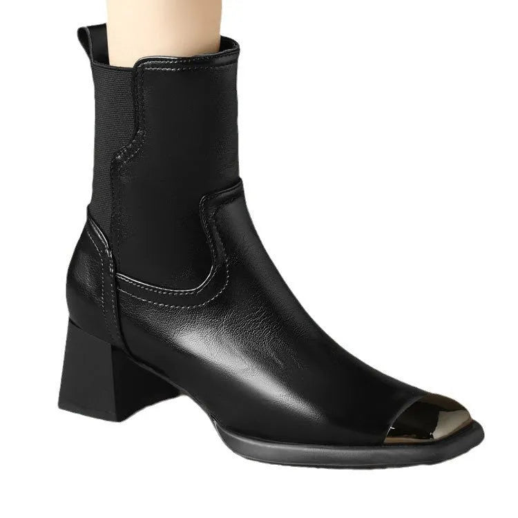 Women's brown cowhide leather Martin boots with a high heel and side zipper on a white background.