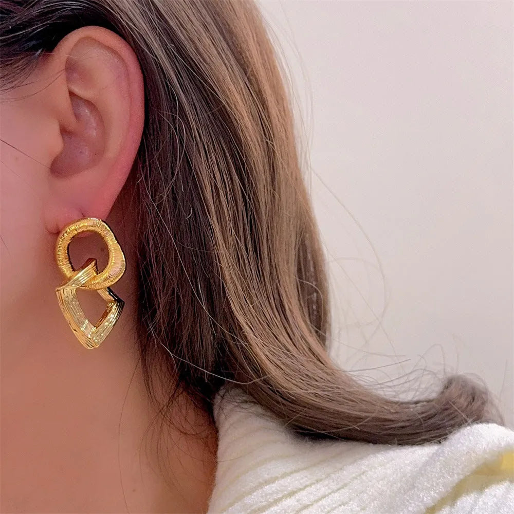 Retro geometric circle pendant earrings in gold or silver finish with 3.4cm drop length