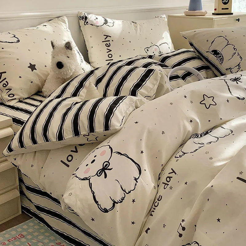 Cartoon dog pattern cotton bed sheet four-piece set shown on bed with matching pillowcases