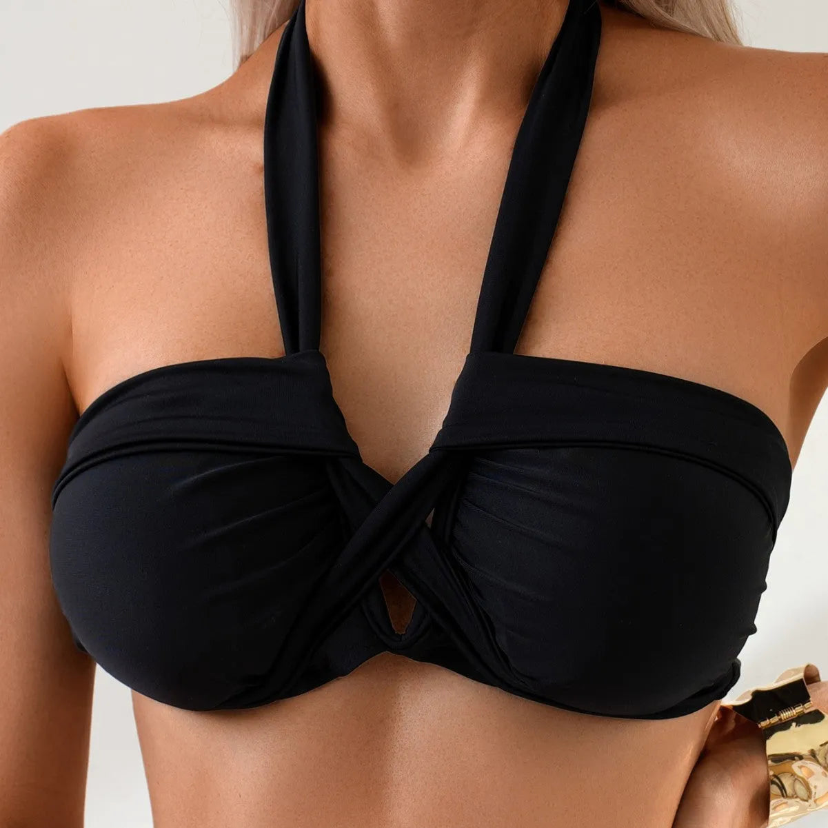 Black solid colour bikini swimsuit with low-back briefs style for swimming.