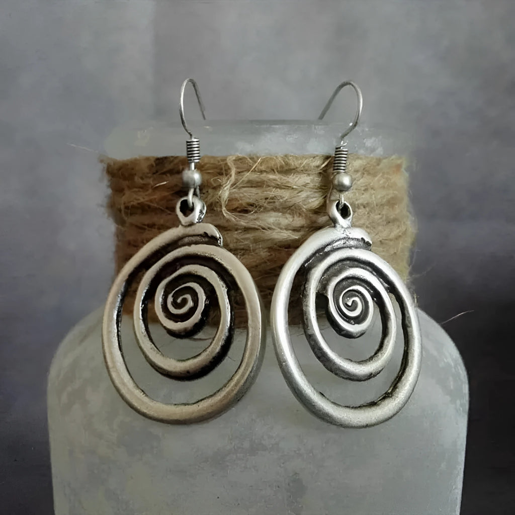 Silver geometric spiral earrings with distressed finish measuring 2.6cm by 5cm