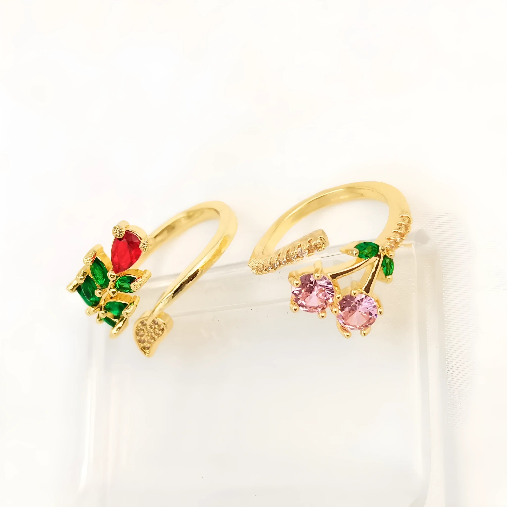 Women's geometric open ring with gold-plated copper construction, leaf design, and zircon crystal accents