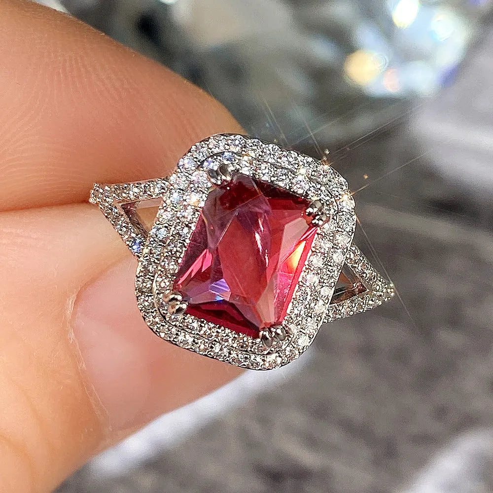 Copper women's ring with square red rhinestone on geometric princess-shaped band