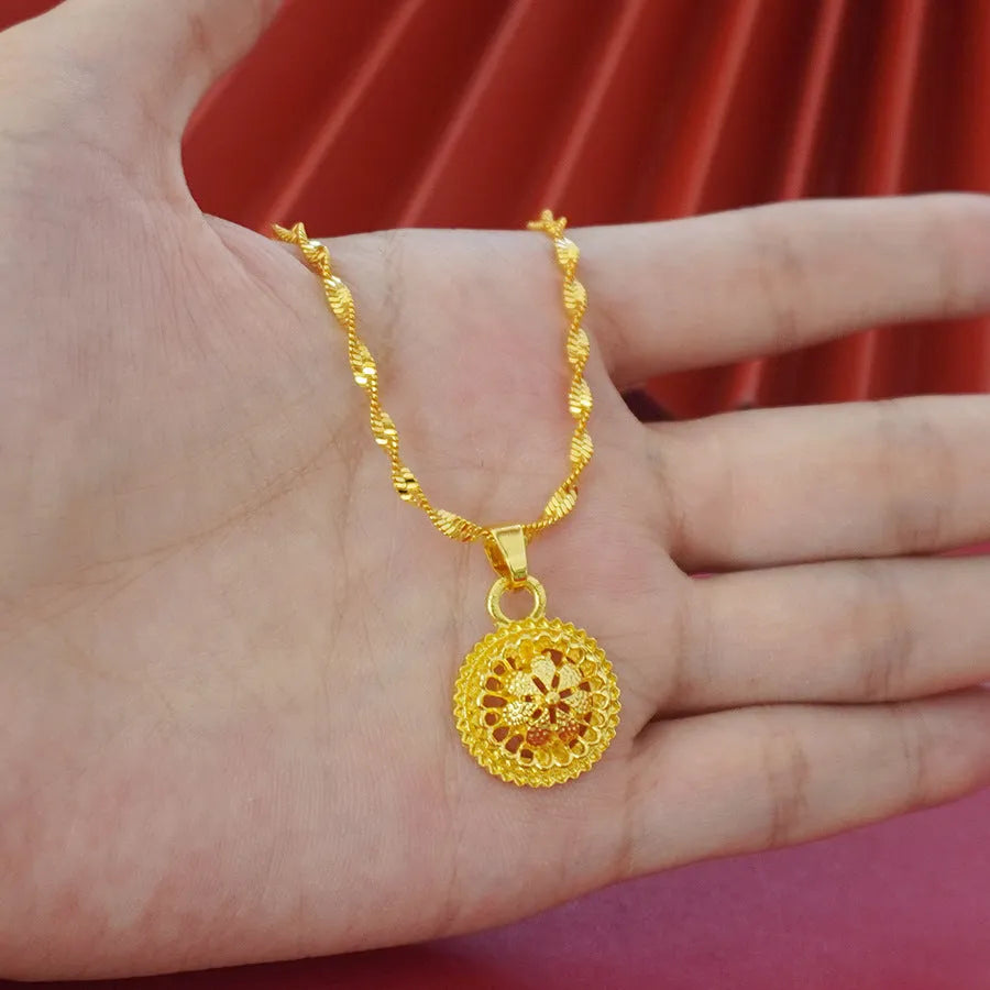 Three-piece gold-plated floral jewellery suit with necklace, earrings and ring on water wave chain