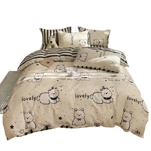 Cartoon dog pattern cotton bed sheet four-piece set shown on bed with matching pillowcases