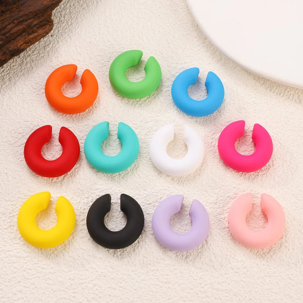 Matte coarse round C-shaped clip-on earrings in a selection of candy colours for women, no piercing required.