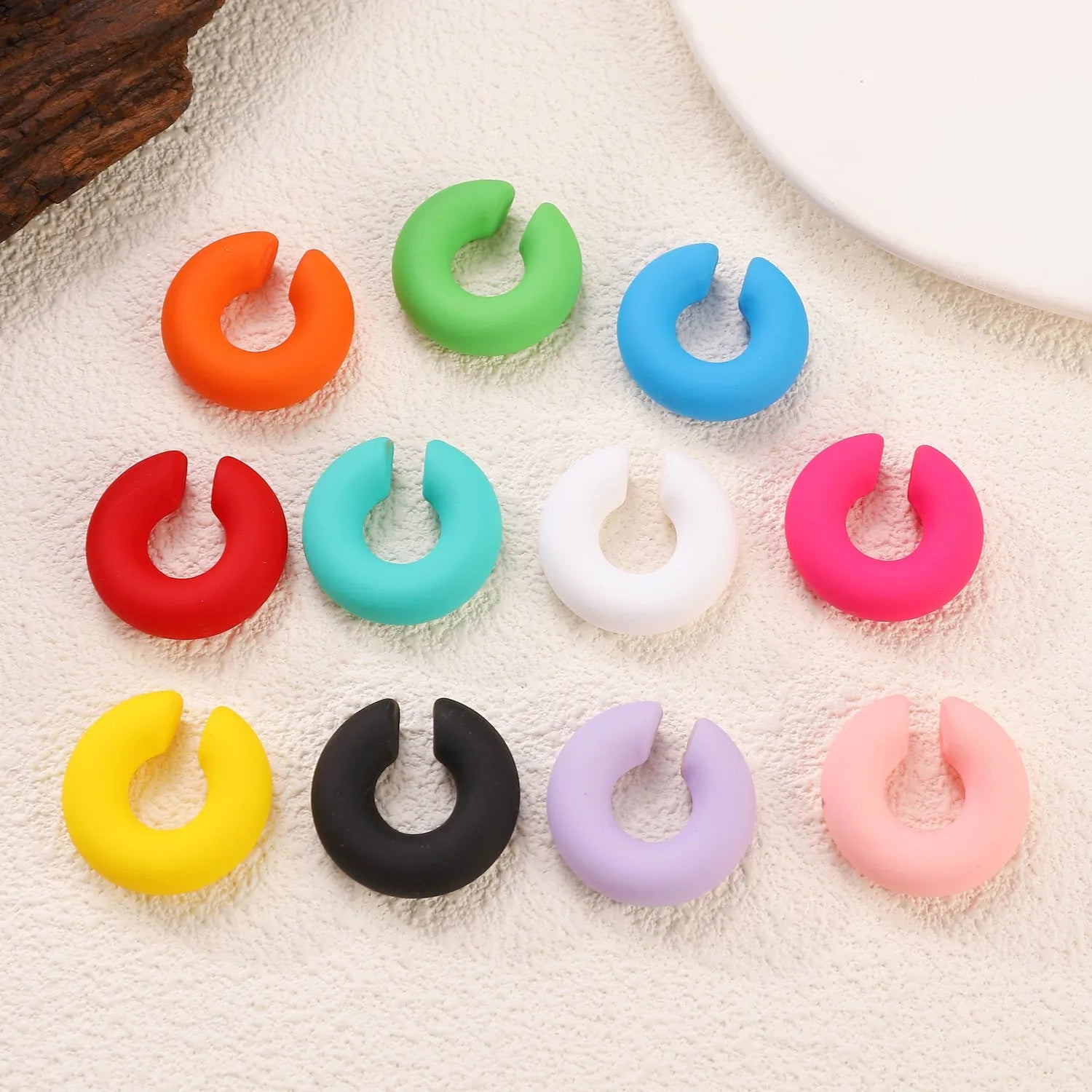 Matte coarse round C-shaped clip-on earrings in a selection of candy colours for women, no piercing required.