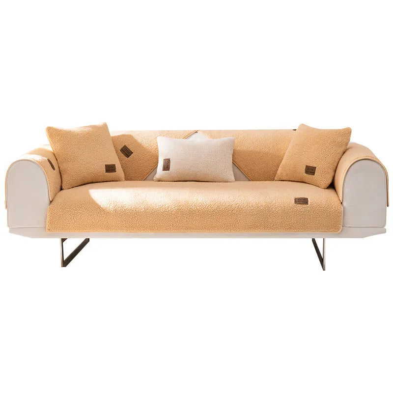 Lambswool sofa cover in solid colour on a sofa, shown in blue, grey, green, white, or yellow.