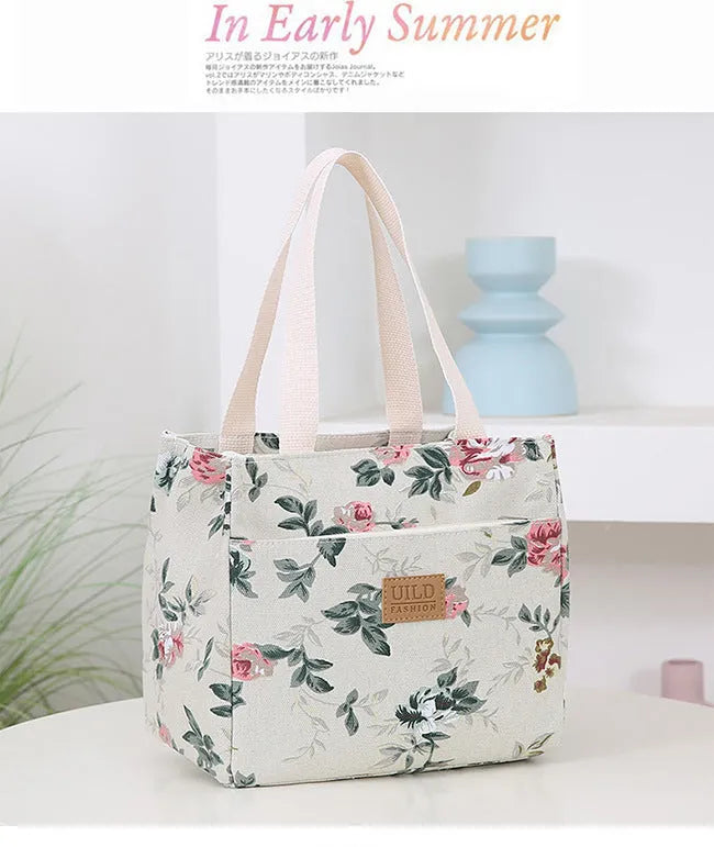 Women's printed canvas handbag with aluminium frame in square horizontal design showing floral pattern