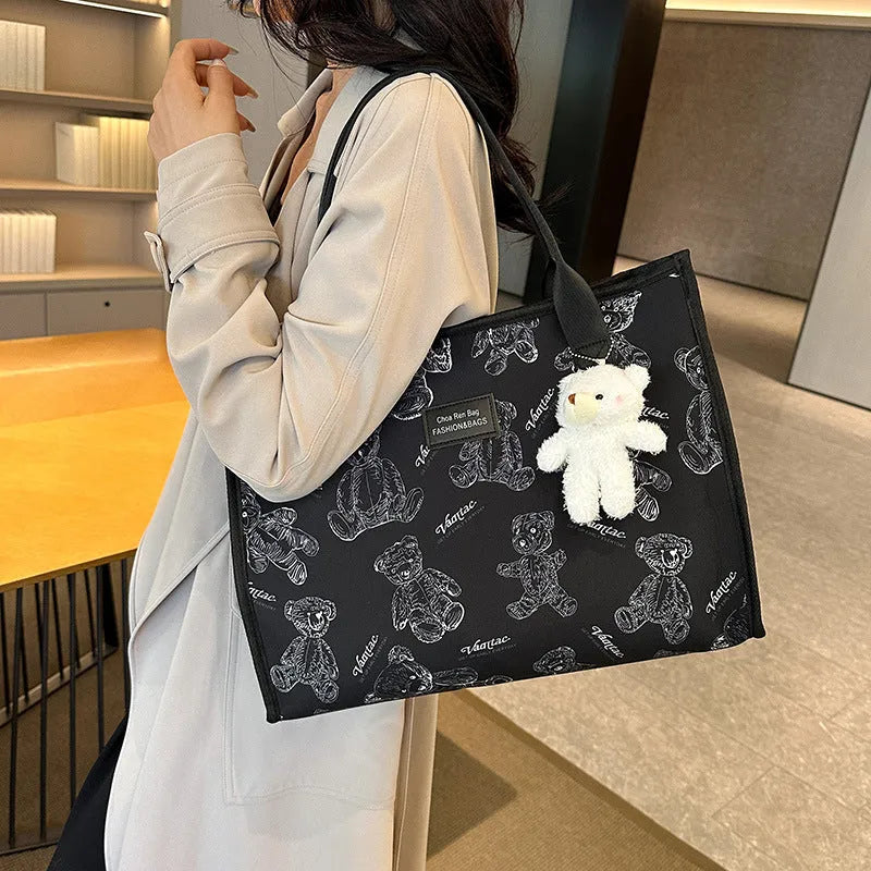 Canvas tote bag with rhombus pattern design showing sandwich pocket and shoulder strap