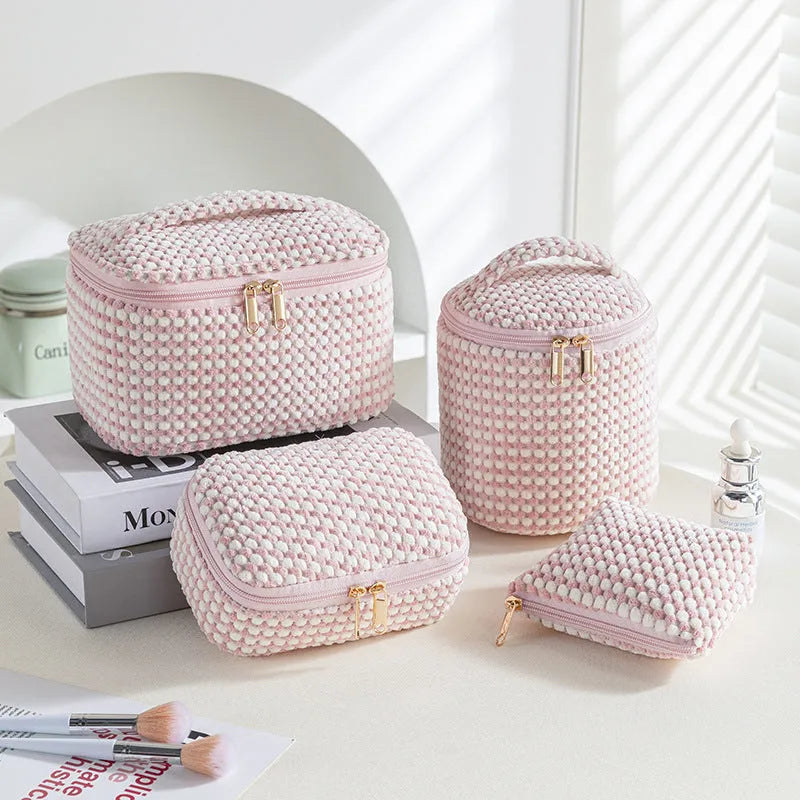 Four cube-style flannelette makeup bags in a set, shown in blue with dots colour option.