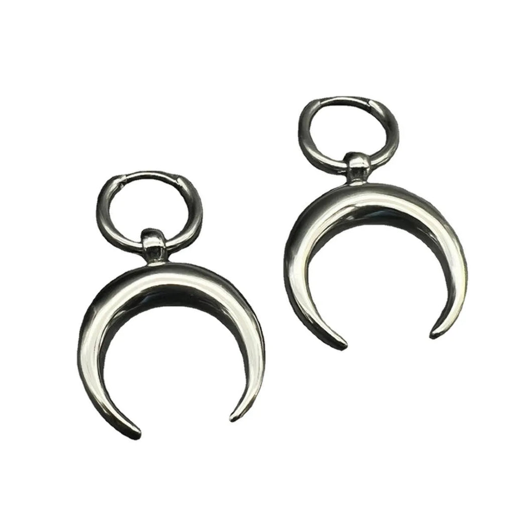 Silver alloy big hoop earrings with a gothic moon design and ear clip back.