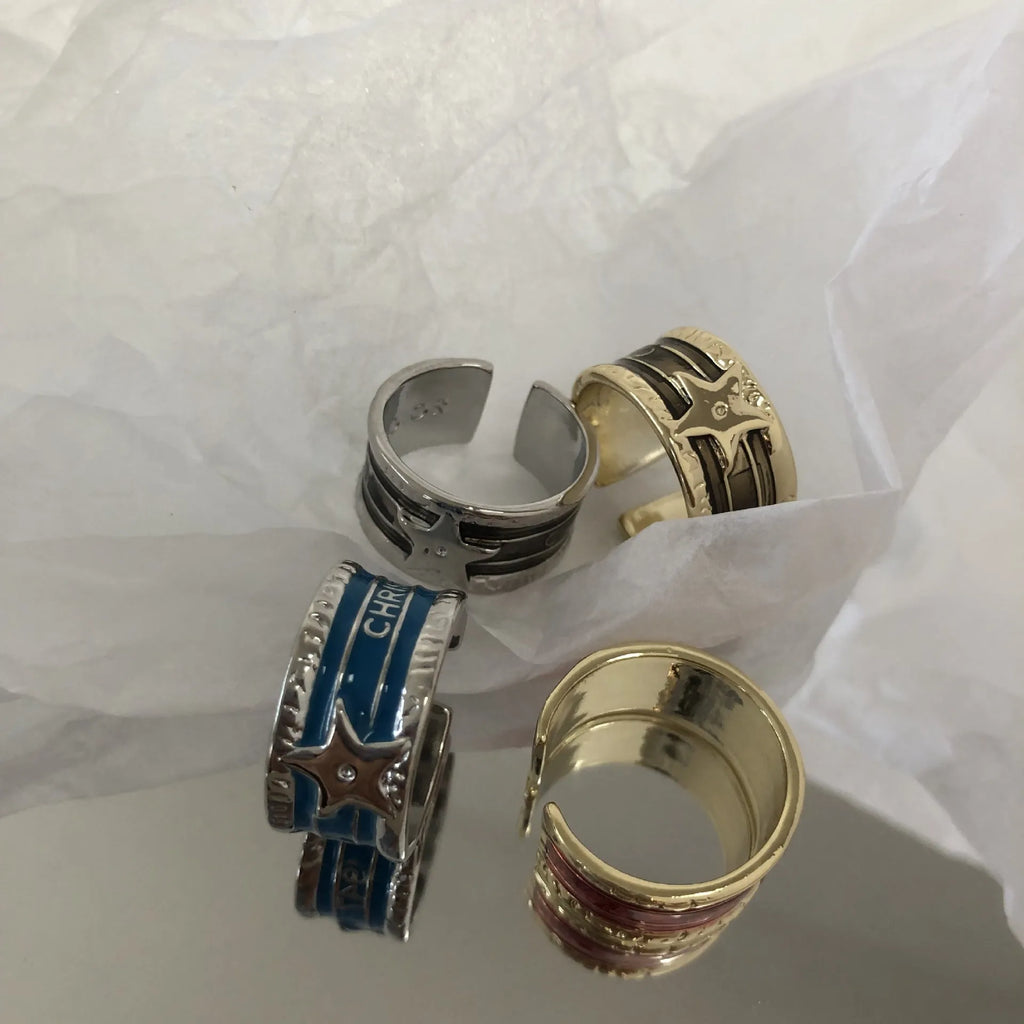 Adjustable copper ring with XINGX drop oil geometric design and distressed retro finish.