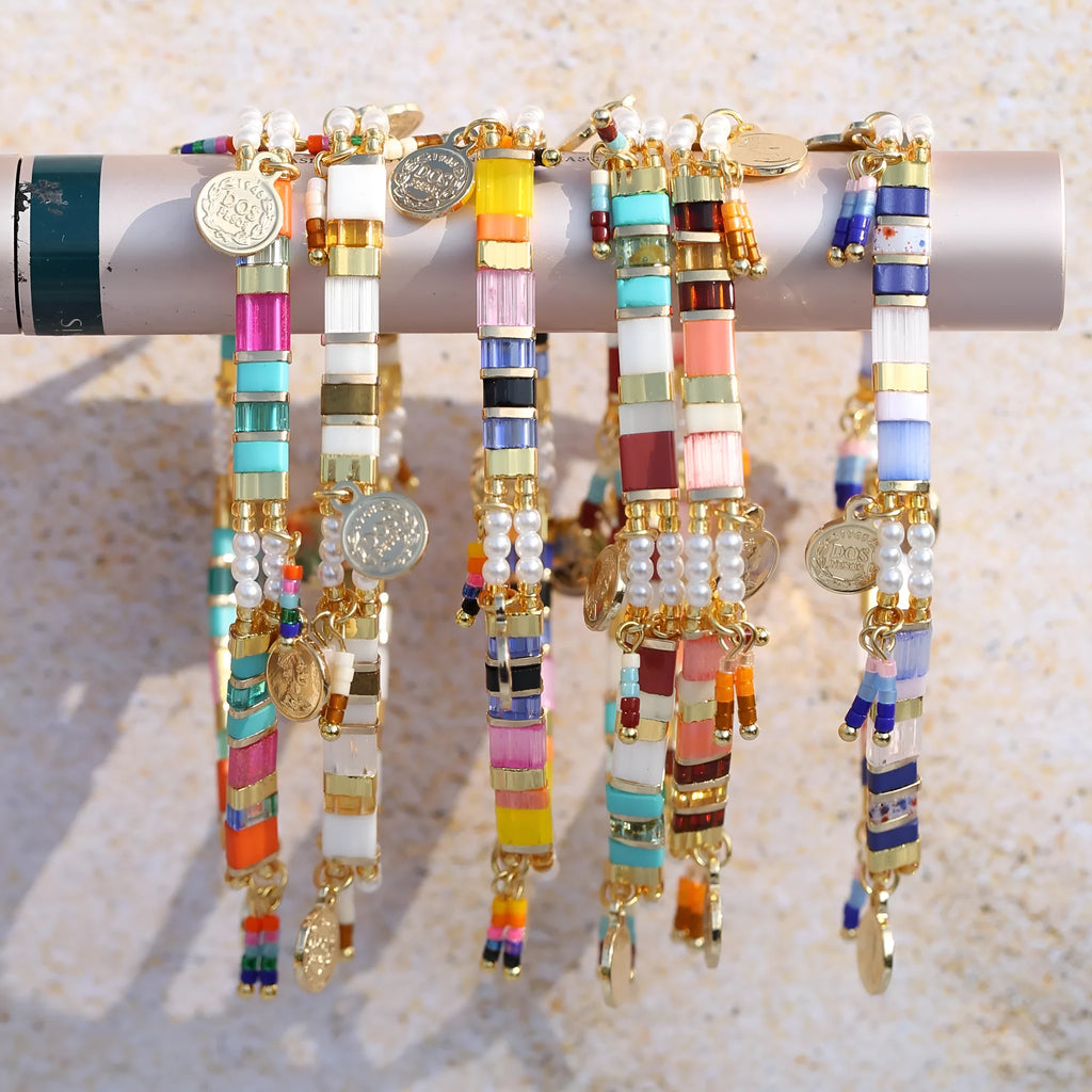 Handcrafted women's bracelet with imitation pearl beads in European style, showing colour variations.