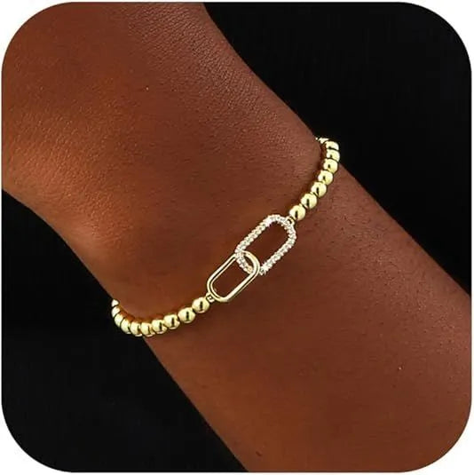 Women's adjustable stainless steel bracelet with a round geometric bead in a selection of colours.