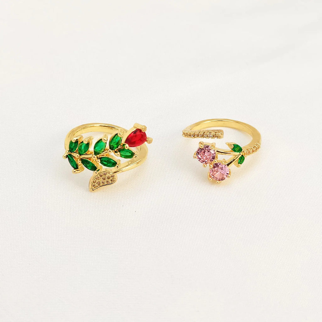 Women's geometric open ring with gold-plated copper construction, leaf design, and zircon crystal accents