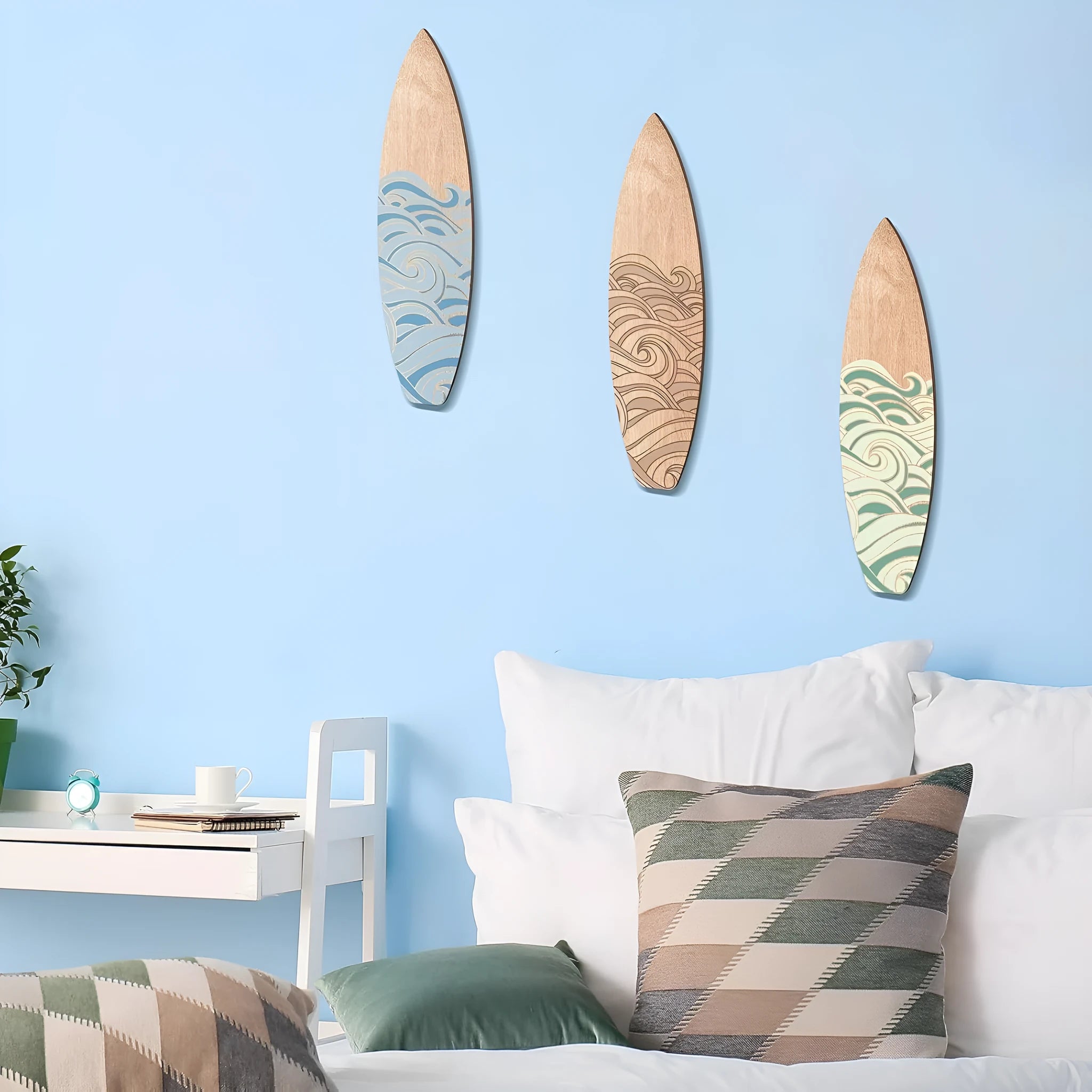 Set of three identical wooden surfboard-shaped wall decorations on a white background.
