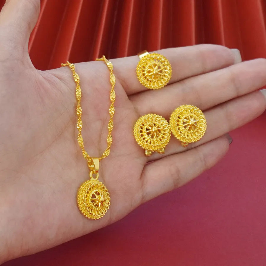 Three-piece gold-plated floral jewellery suit with necklace, earrings and ring on water wave chain
