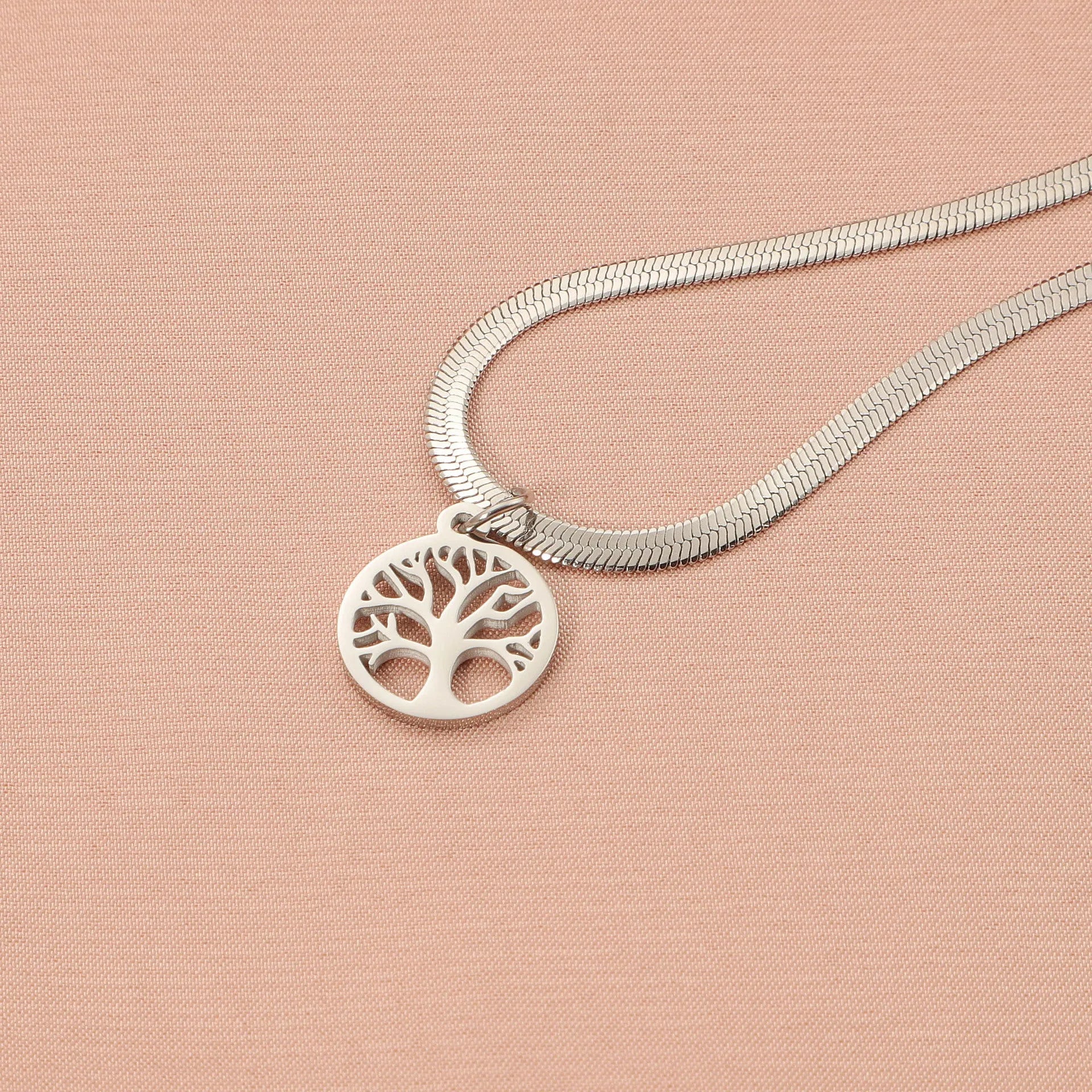 Stainless steel necklace with tree pendant on snake bone chain in gold or steel colour.