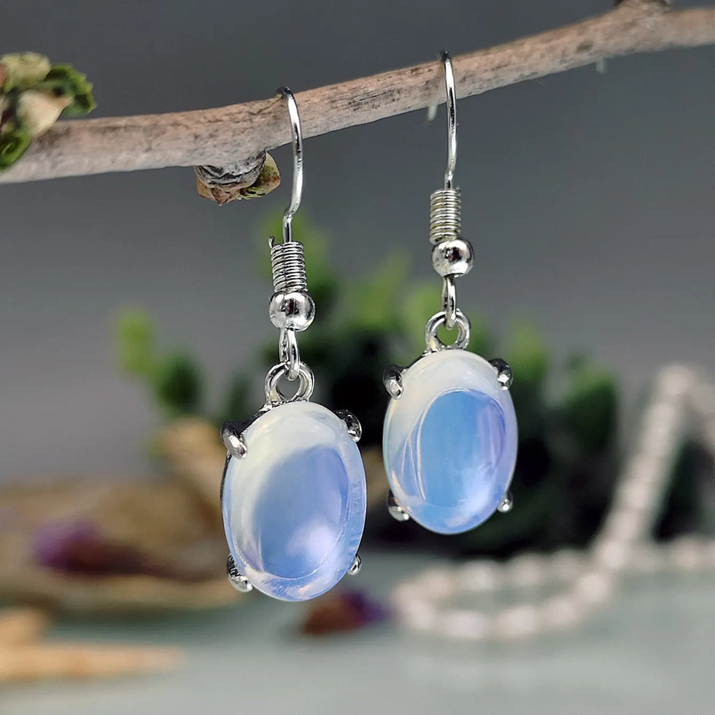 Moonlight white opal earrings with electroplated alloy drop shape design and ellipse silhouette elements
