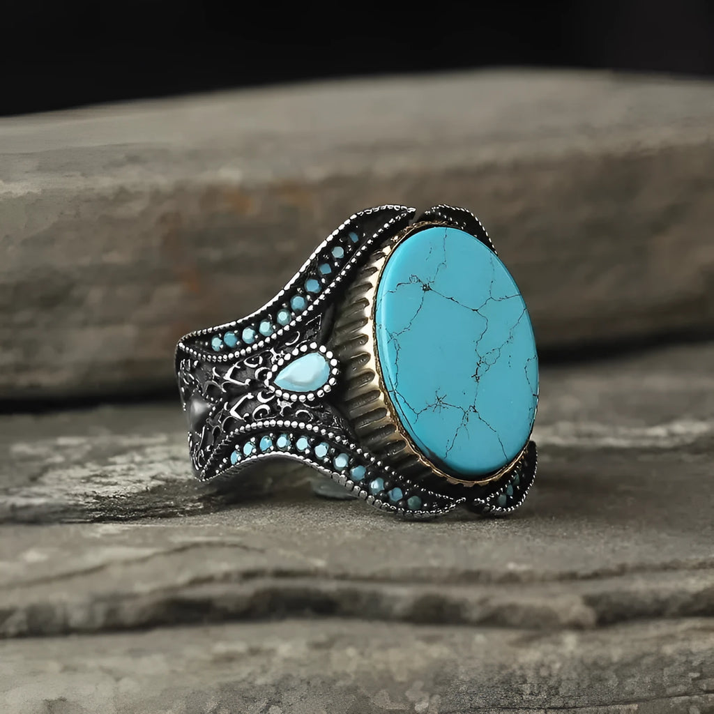 Men's antique silver alloy ring with a round design and central turquoise stone.