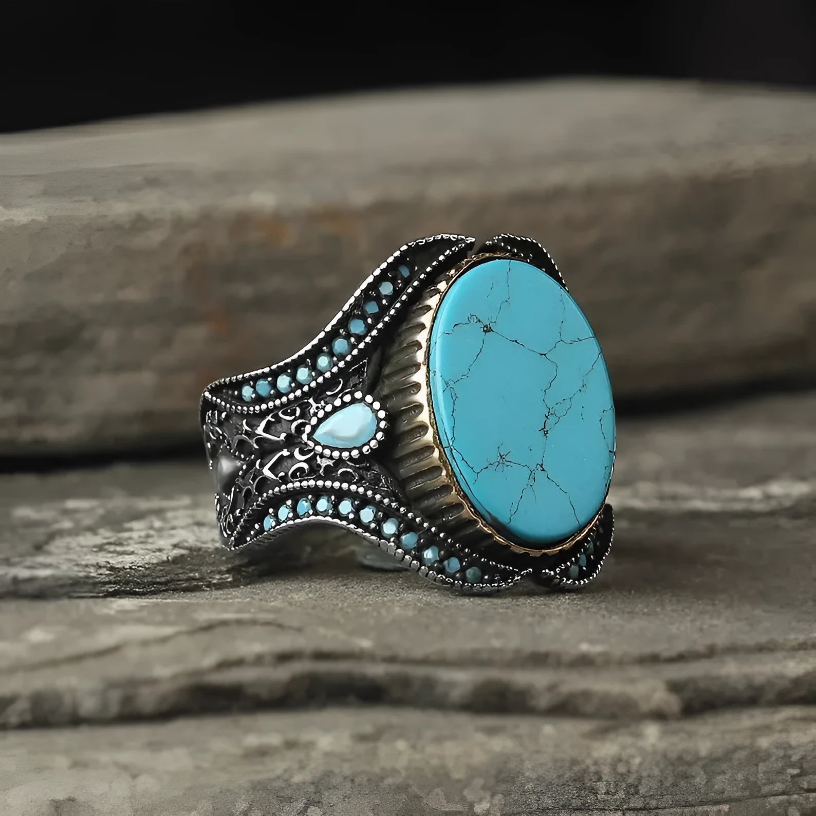 Men's antique silver alloy ring with a round design and central turquoise stone.