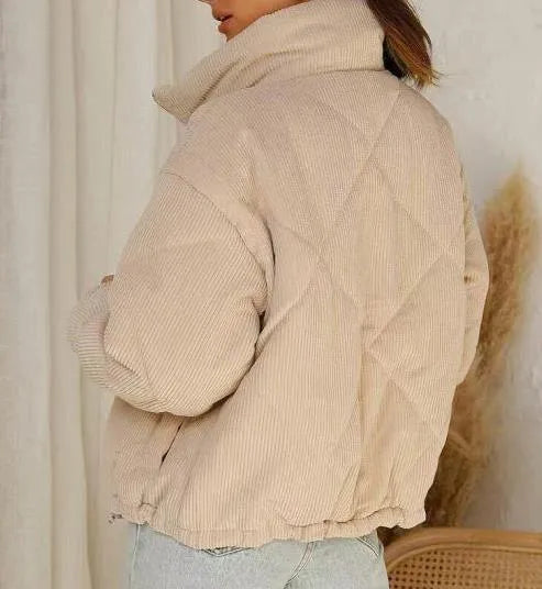 Women's apricot corduroy jacket with stand collar, long sleeves, and full-length zipper closure