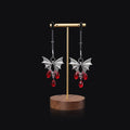 Silver alloy adjustable bat nipple clamp with ruby decorative clip for adult use.