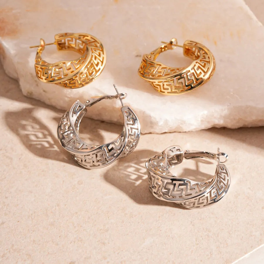 Twisted geometric hollow stud earrings in silver and gold electroplated finishes