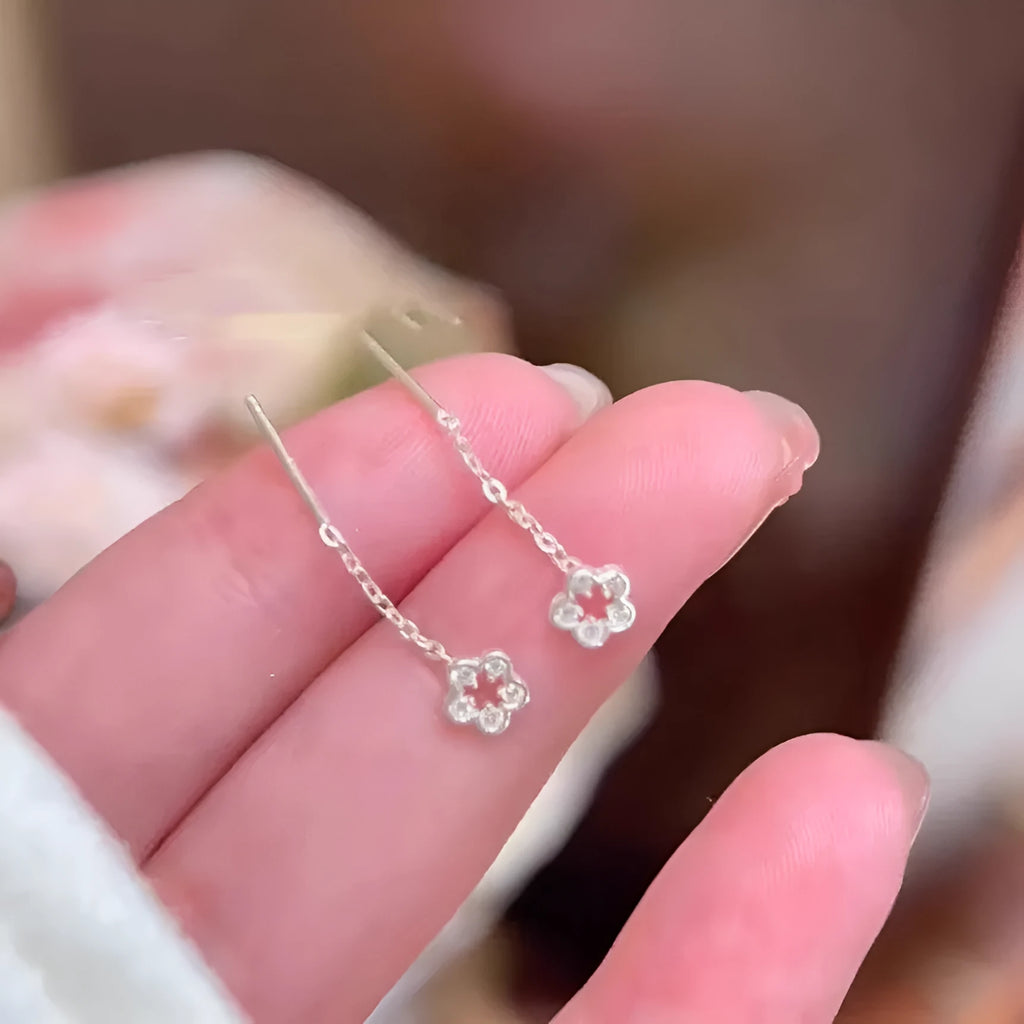 Silver colour hollow flower hanging earrings with natural petal design