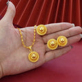 Three-piece gold-plated floral jewellery suit with necklace, earrings and ring on water wave chain
