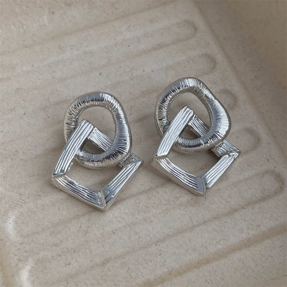 Retro geometric circle pendant earrings in gold or silver finish with 3.4cm drop length